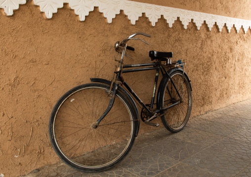 Bicycle parked against a wall, Jazan Province, Farasan, Saudi Arabia