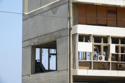 Broken windows and crumbling concrete facades mark the Electricite du Liban headquarters building damaged by the 2020 Beirut port explosion, Beirut Governorate, Beirut, Lebanon