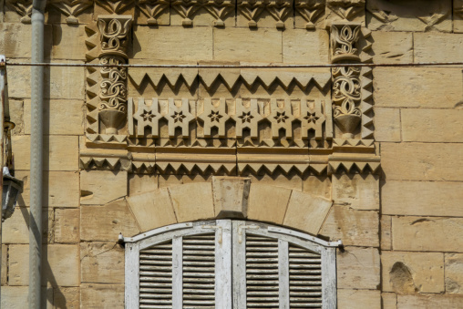 Ornate stone carvings with star and zigzag motifs decorate a traditional building facade, Beqaa Governorate, Zahle, Lebanon