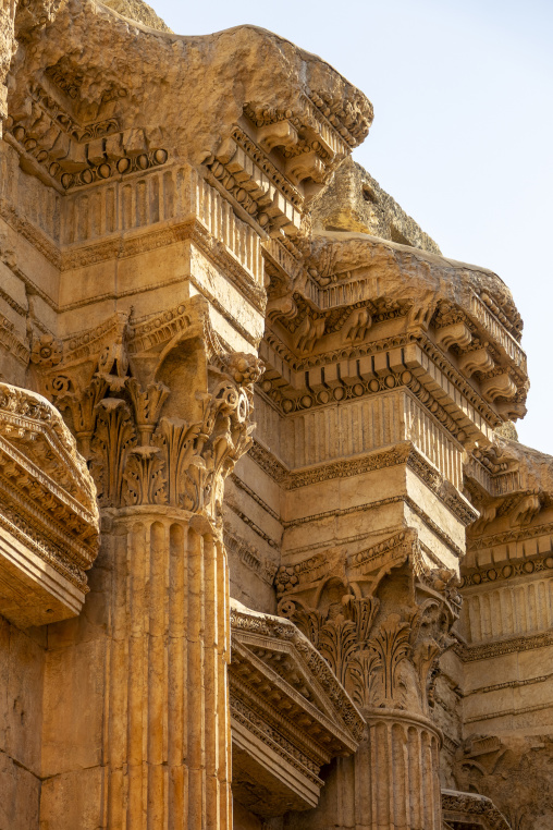 Monumental Corinthian columns and carved entablature rise above the ancient Roman temple ruins, Baalbek-Hermel Governorate, Baalbek, Lebanon