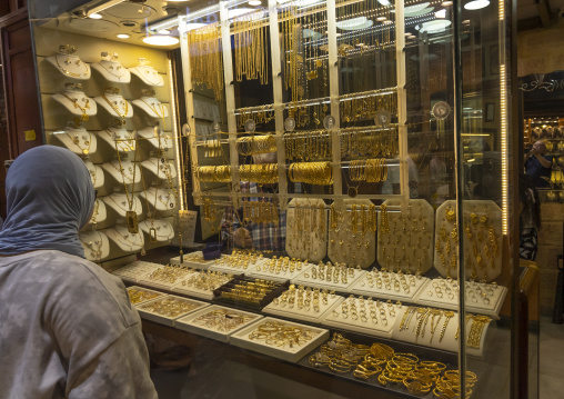 Woman looking at gold in a shop, North Governorate, Tripoli, Lebanon