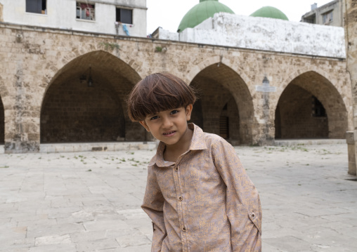 Boy in Al Mansouri Al Kabir mosque courtyard, North Governorate, Tripoli, Lebanon