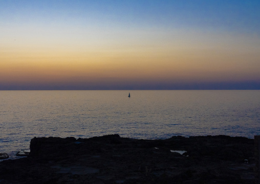 Boat sailing at sunset, North Governorate, Batroun, Lebanon