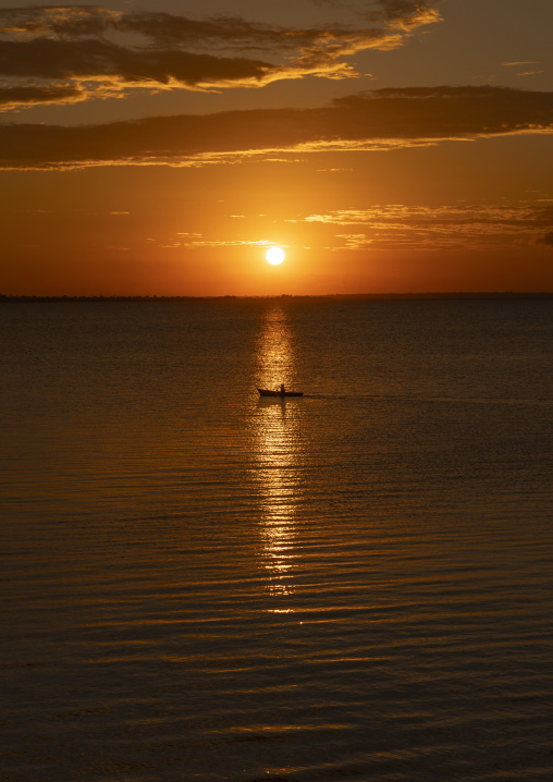 Fisherman in a canoe in the sunset, Nampula Province, Island of Mozambique, Mozambique