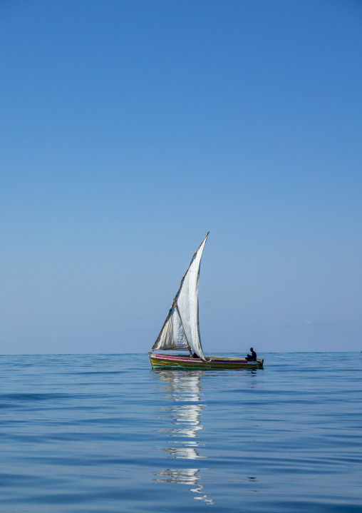 Dhow sailing on quiet sea, Nampula Province, Island of Mozambique, Mozambique