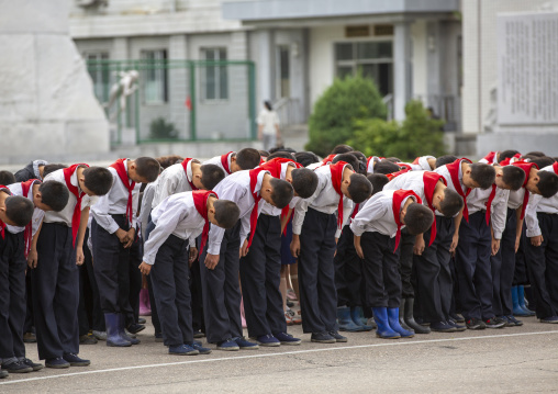 North Korean pioneers paying respect to the Leaders in Mansudae art studio, DGC, Pyongyang, North Korea