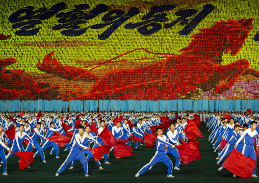 North Korean gymnasts with red flags during the Arirang mass games, DGC, Pyongyang, North Korea