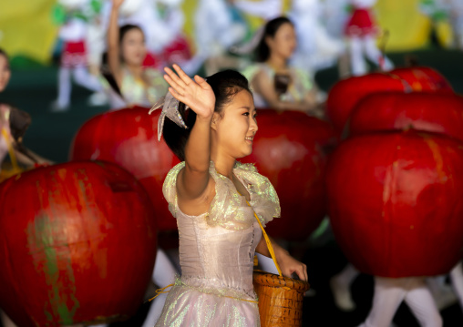 Women dancing between apples at Arirang mass games, DGC, Pyongyang, North Korea