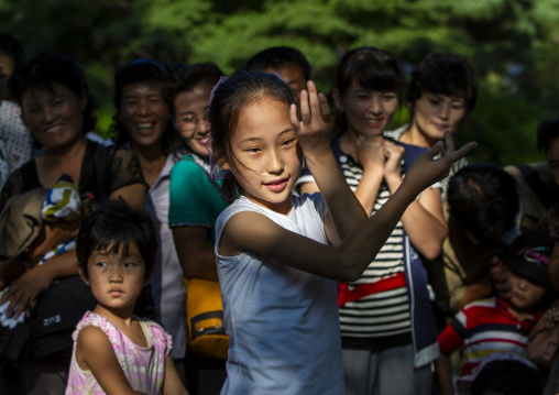 North Korean girl dancing in a park on september 9, DGC, Pyongyang, North Korea