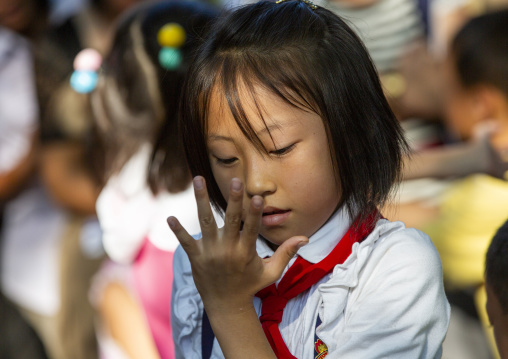 North Korean girl dancing in a park on september 9, DGC, Pyongyang, North Korea