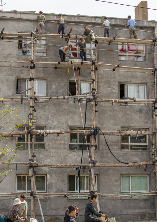 North Korean workmen on a dangerous scaffolding, South Hamgyong, Hamhung, North Korea