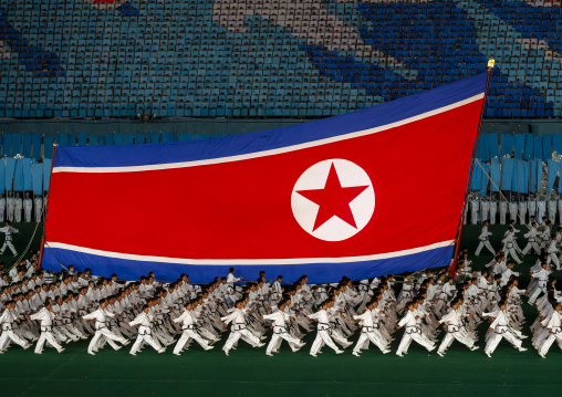 North Korean taekwondo team with a giant flag during the Arirang, DGC, Pyongyang, North Korea