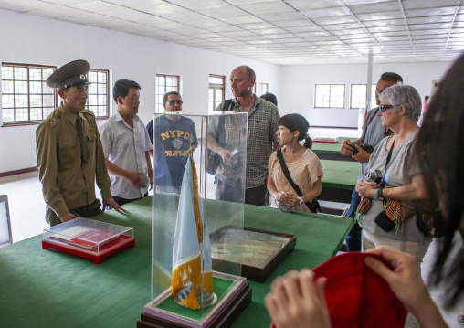 Tourists looking the armistice agreement in the peace museum, North Hwanghae, Panmunjom, North Korea