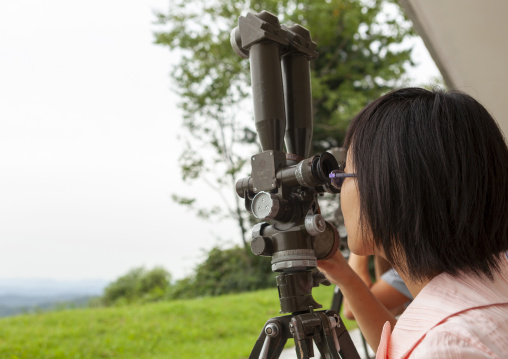 Guide looking at south Korea from the wall section of the DMZ, North Hwanghae, Panmunjom, North Korea
