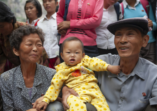 North Korean family posing for a picture in a park, North Hwanghae, Kaesong, North Korea