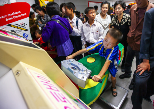 North Korean boy playing video games in Kaeson youth park, DGC, Pyongyang, North Korea