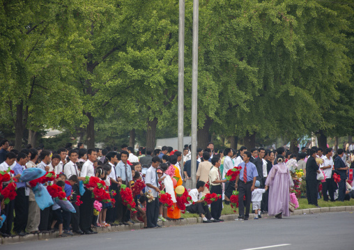 People celebrating the regim anniversary in the street, DGC, Pyongyang, North Korea