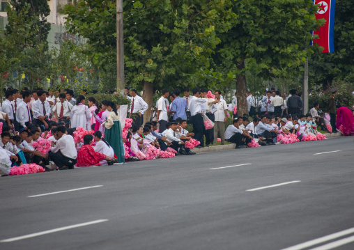 People celebrating the regim anniversary in the street, DGC, Pyongyang, North Korea
