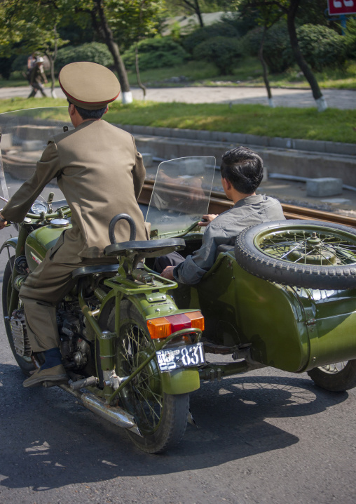 North korean soldiers on a side car in the city, DGC, Pyongyang, North Korea
