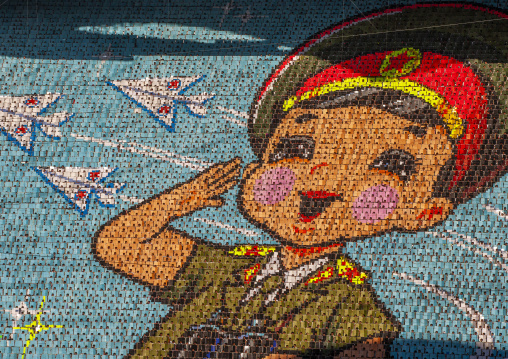 Children holding up boards during Arirang to create a soldier boy, DGC, Pyongyang, North Korea