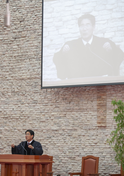Pastor speaking in protestant Bongsu church, DGC, Pyongyang, North Korea