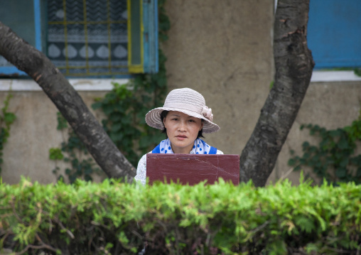 North Korean woman with a hat in the street, DGC, Pyongyang, North Korea