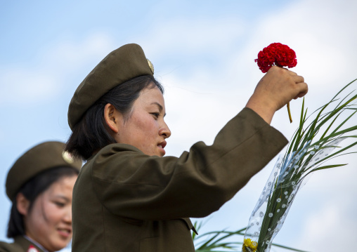 North Korean soldiers women with flowers, DGC, Pyongyang, North Korea