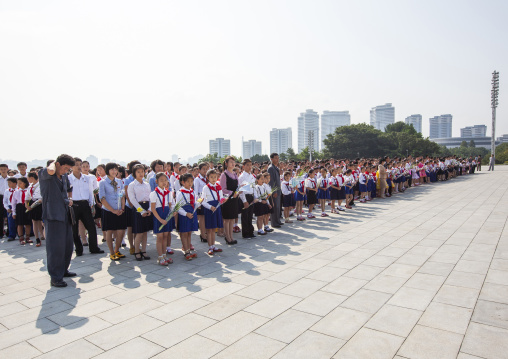 Pioneers from the Korean children's union in the Grand monument, DGC, Pyongyang, North Korea