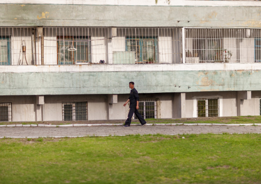 North Korean man in front of a building, DGC, Pyongyang, North Korea