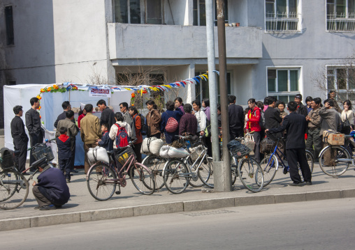North Korean people queueing to buy food in the street, DGC, Pyongyang, North Korea