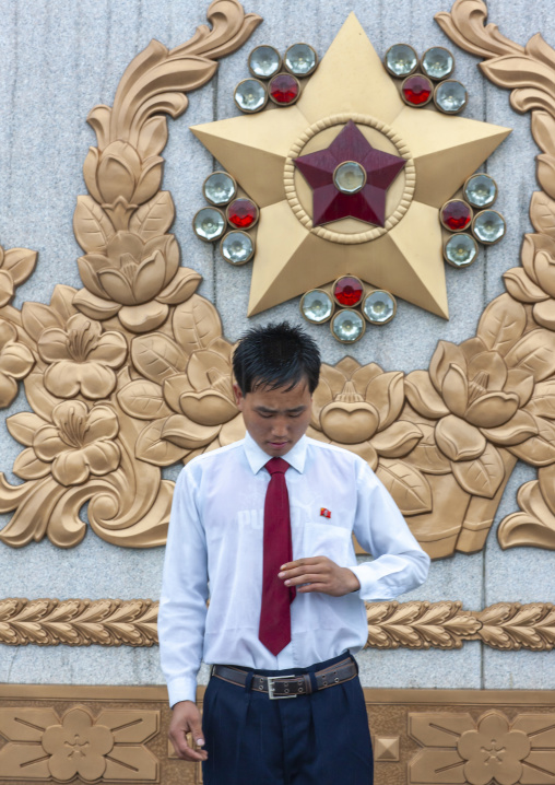 North Korean man under the rain in Kumsusan memorial palace, DGC, Pyongyang, North Korea