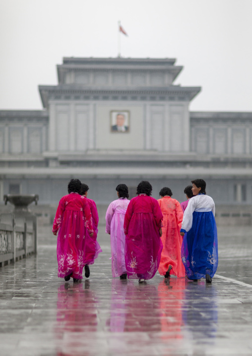 North Korean women under the rain in Kumsusan memorial palace, DGC, Pyongyang, North Korea