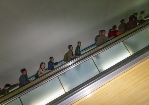 North Korean people using escalator leading to the subway station, DGC, Pyongyang, North Korea