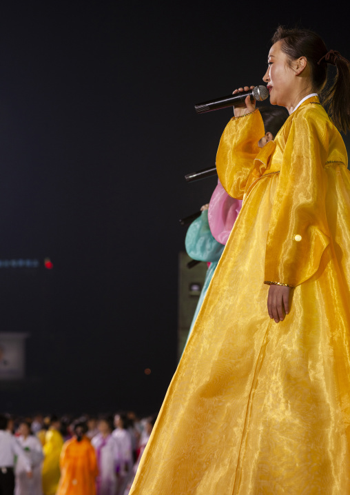 North Korean artists singing during a mass dance on Kim il Sung square, DGC, Pyongyang, North Korea