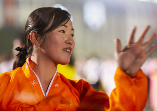 Woman dancing to celebrate april 15 the birth anniversary of Kim Il-sung, DGC, Pyongyang, North Korea
