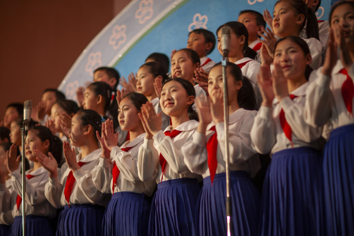 Pioneers singing during a show at Mangyongdae children's palace, DGC, Pyongyang, North Korea