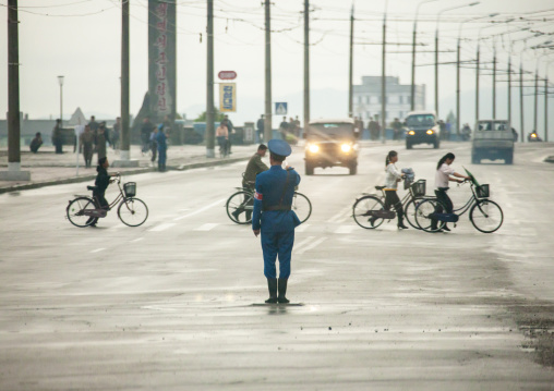 North Korean male traffic security officer in the street, South Hamgyong, Hamhung, North Korea