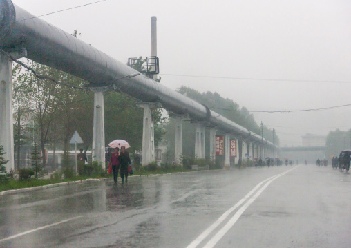 Giant pipe for heating alongside an empty road, South Hamgyong, Hamhung, North Korea