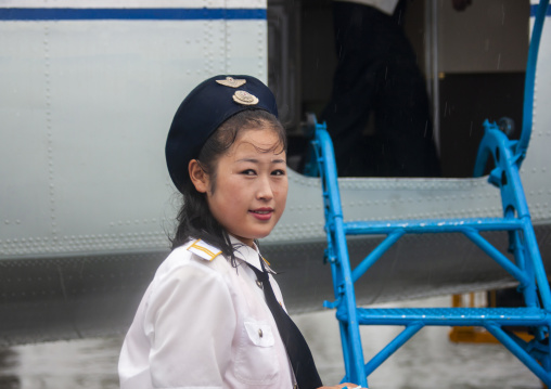 Airport employee before entering a domestic plane, South Hamgyong, Hamhung, North Korea