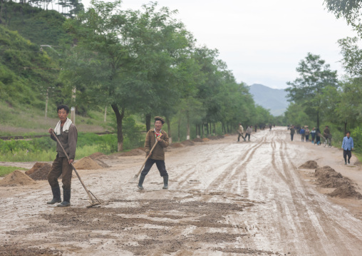 Workers repairing muddy road in the countryside, North Hamgyong, Jung Pyong Ri, North Korea