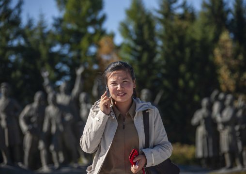 North Korean guide on the phone in the Grand monument of lake Samji, Ryanggang, Samjiyon, North Korea