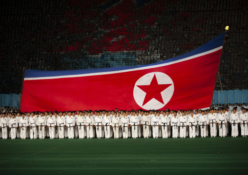 North Korean taekwondo team in front of a giant flag during the Arirang, DGC, Pyongyang, North Korea