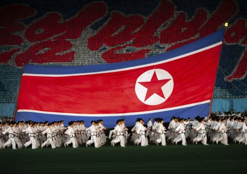 North Korean taekwondo team in front of a giant flag during the Arirang, DGC, Pyongyang, North Korea