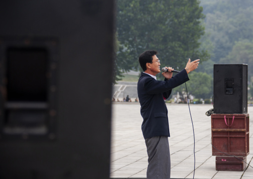 North Korean singer on national day in the street, DGC, Pyongyang, North Korea