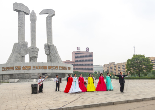State artists on national day in front of the monument to the founding of the Party, DGC, Pyongyang, North Korea