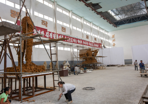 Artists working on a bronze statue at Mansudae art studio, DGC, Pyongyang, North Korea