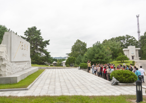 Tourists in front of a stele with Kim il Sung signature, North Hwanghae, Panmunjom, North Korea