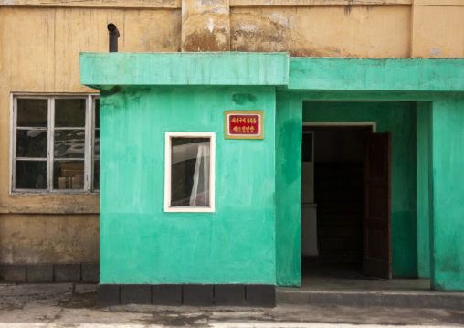 Popular unity 11 sign on a green building, DGC, Pyongyang, North Korea