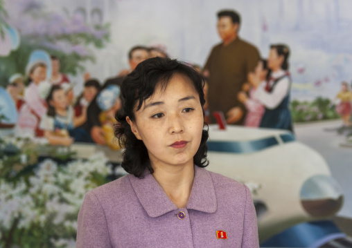 Portrait of a North Korean woman in front of a Kim Jong il fresco, DGC, Pyongyang, North Korea