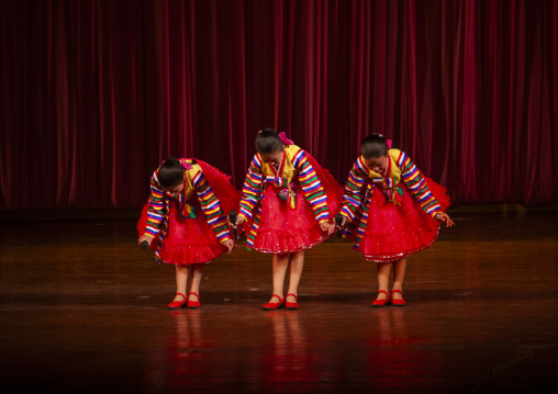North korean girls bowing after a show at Mangyongdae children's palace, DGC, Pyongyang, North Korea